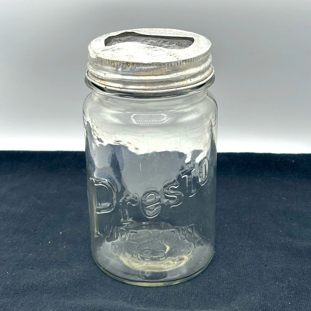 VTG. Rare Presto wide mouth cylindrical shape qt. Jar with glass bow tie lid.